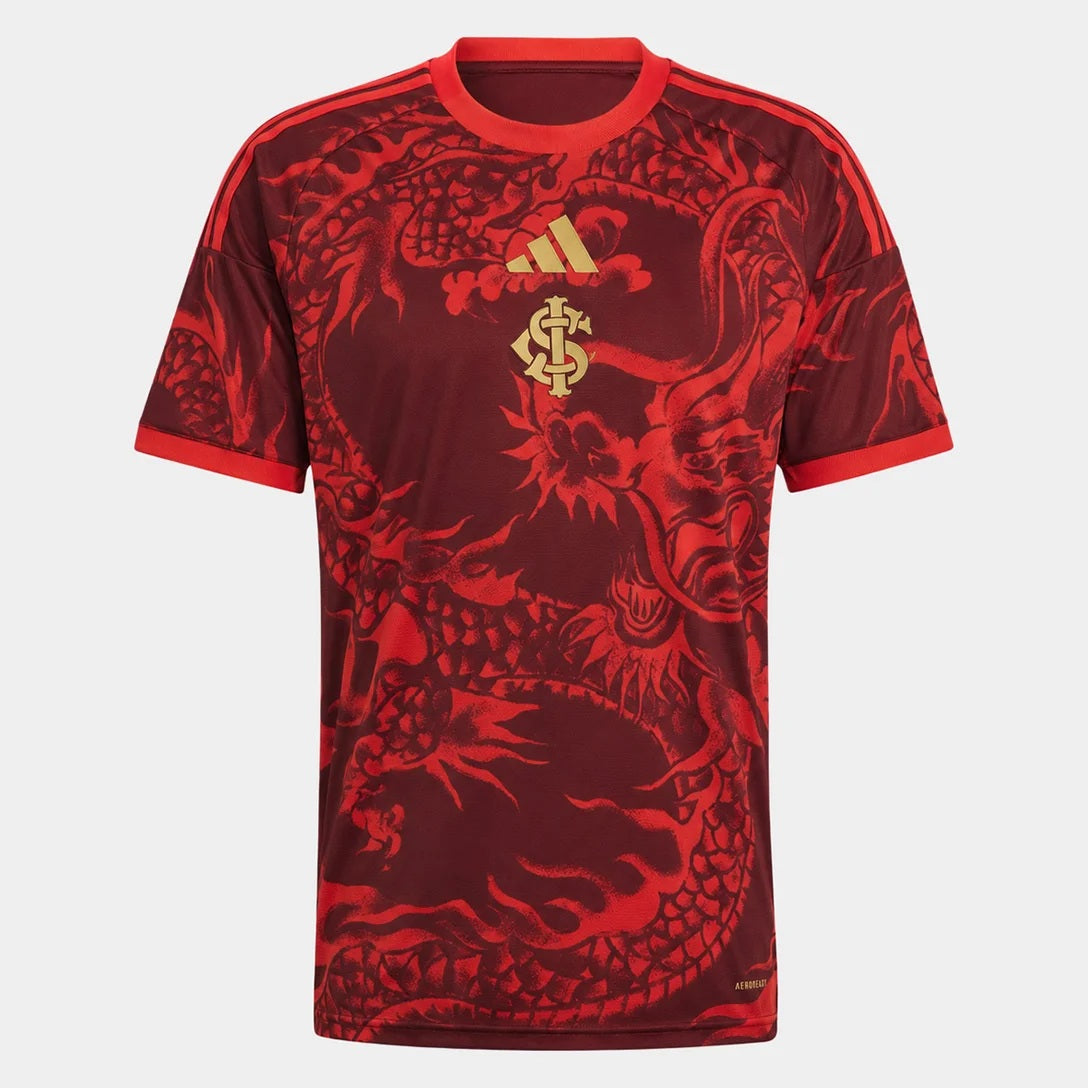 Camisa Internacional III 2026/27 Torcedor Adidas masculina vermelho escuro, com grafismo de dragão japonês e detalhes dourados em homenagem à conquista mundial no Japão.